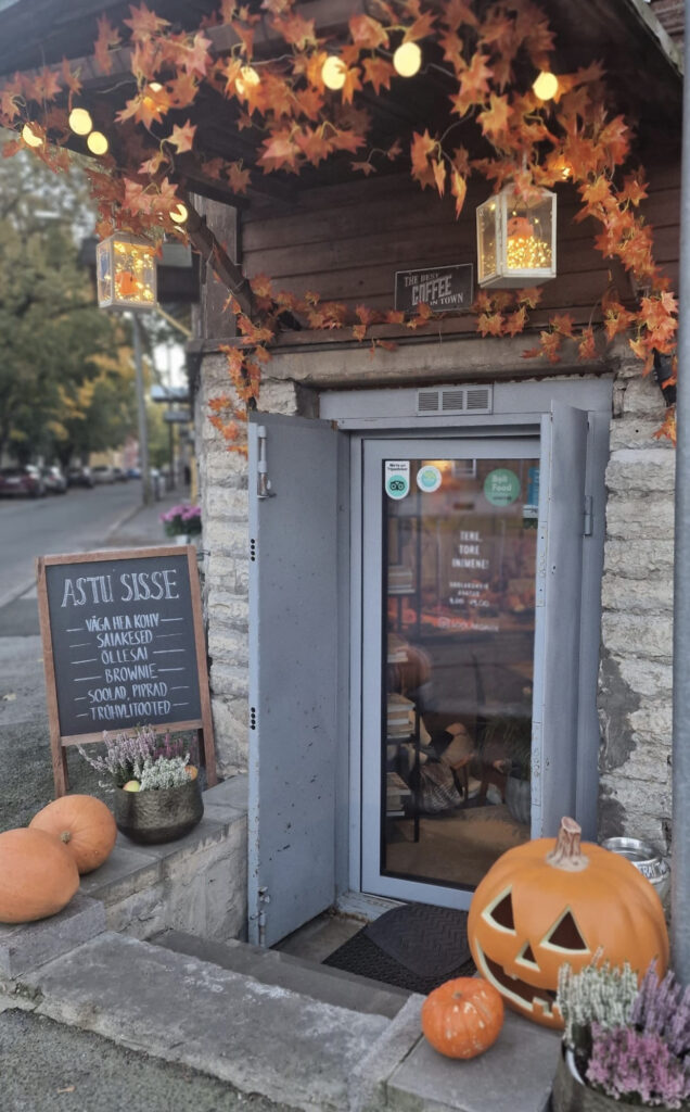 Salt'sUp Salt Café decorated with an oversized artificial pumpkin, real pumpkins, and Halloween-themed items.