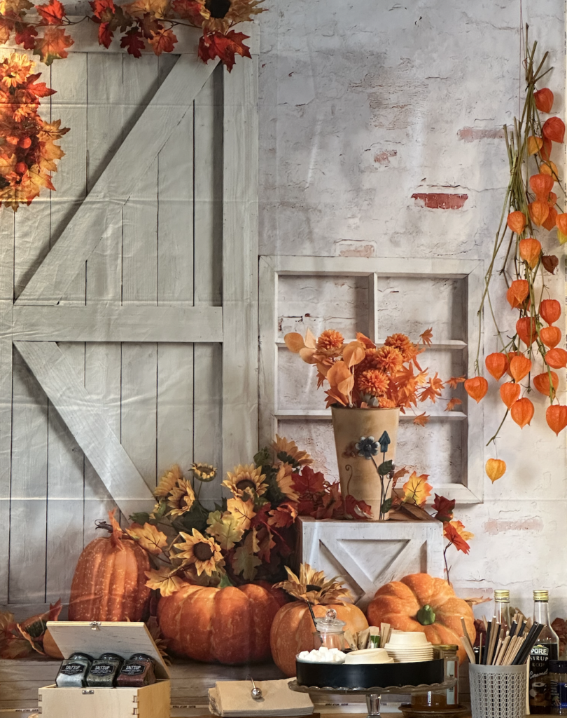 Café corner decorated with Halloween-themed items, including mini pumpkins and ghost figurines.