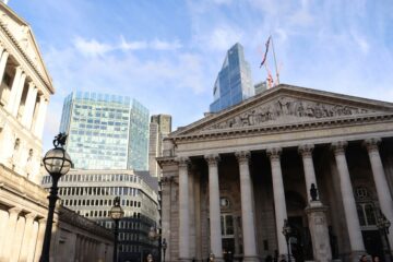 London's Bank of England and modern skyscrapers showing financial contrast.